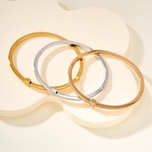 Diamond studded T-coil bracelet