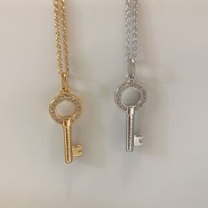 Elliptical hollow diamond inlaid mini key necklace